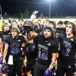 Sequim Gazette photos by Michael Dashiell
Liam Wiker (with trophy) and the Sequim Wolves celebrate winning the Rainshadow Rumble trophy in Sequim on Sept. 27, following a 27-7 Homecoming weekend win over rival Port Angeles.