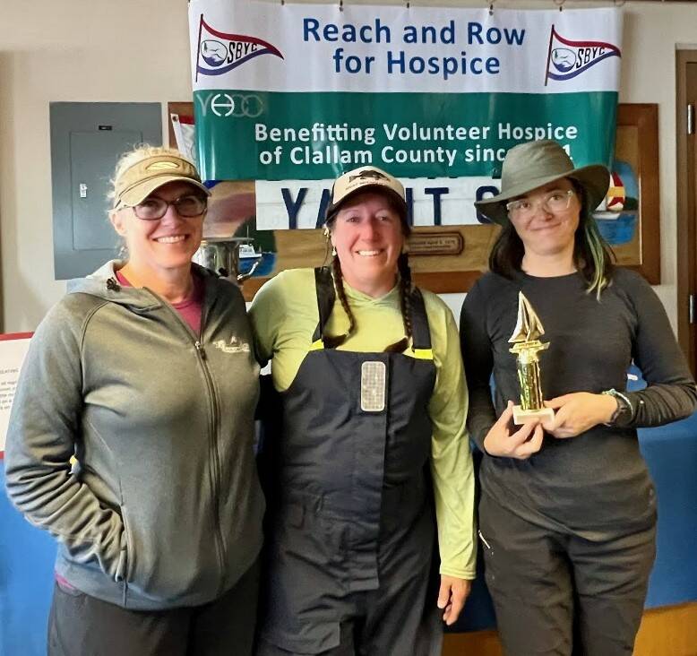 Photo courtesy of Sequim Bay Yacht Club / Crew members of Kicks celebrate a first place finish in the Class C category at the Reach Row for Hospice sailing regatta in September.