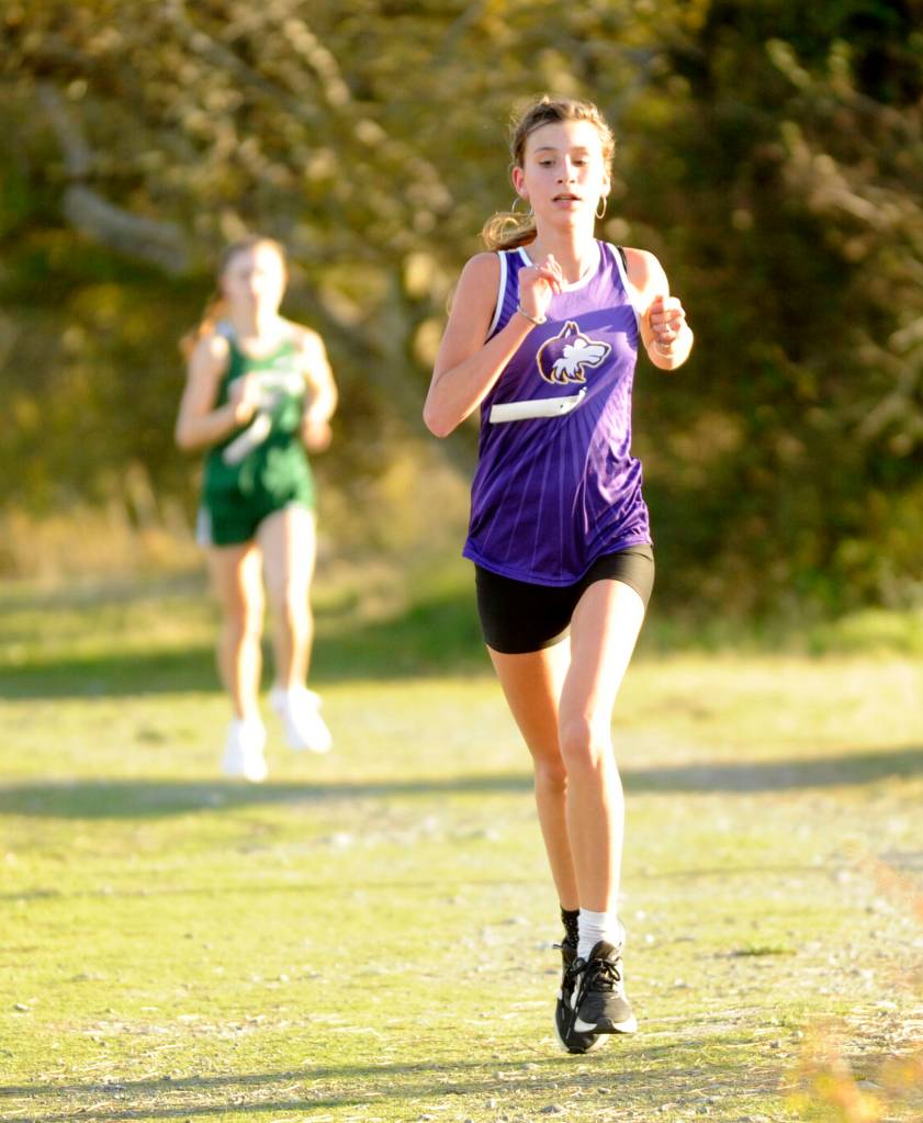 Sequim Gazette photo by Michael Dashiell / Sequim freshman Marea Denton competes in an Olympic League cross country meet at Voice of America at the Dungeness Recreation Area on Oct. 2.