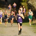 Sequim Gazette photo by Michael Dashiell / Sequims Adrian Osborne runs ahead of the pack during the Olympic League cross country meet at Voice of America at the Dungeness Recreation Area on Oct. 2.