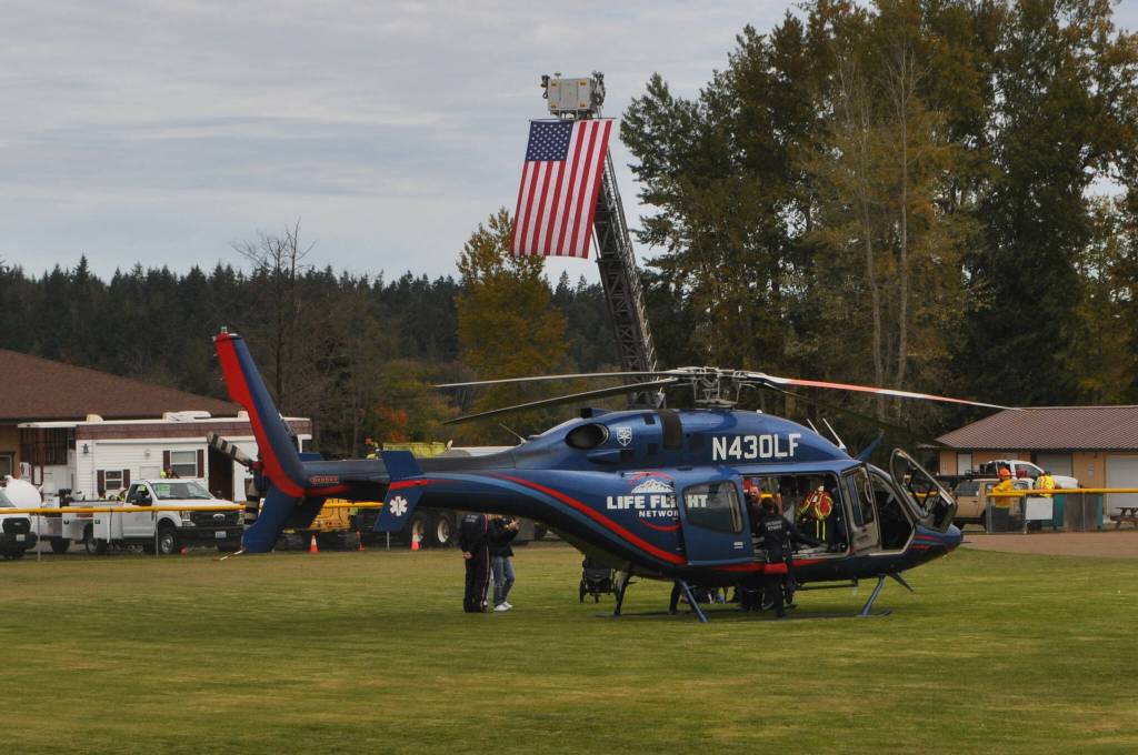 Sequim Gazette photo by Matthew Nash/ Visitors got the chance to sit inside a Life Flight Network helicopter at the Sequim Public Safety Fair.