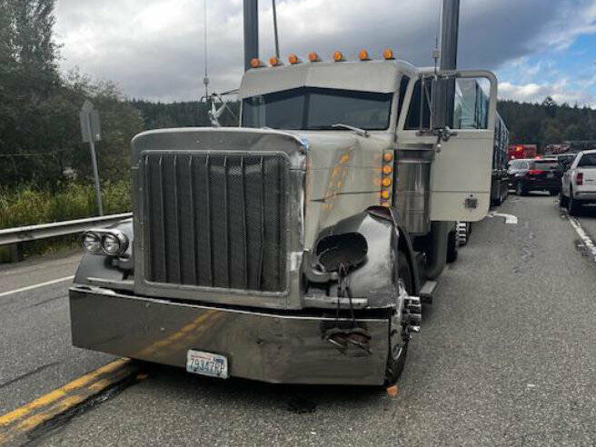 Photo courtesy Chris Turner, Clallam County Fire District 3/ A semi-truck driver is uninjured after an SUV allegedly failed to yield while turning west onto U.S. Highway 101 from 7 Cedars Casino on Oct. 4. The SUVs passenger was flown to Harborview Medical Center, and the driver was taken to Olympic Medical Center in Port Angeles and later arrested under suspicion of driving under the influence, reports Washington State Patrol.