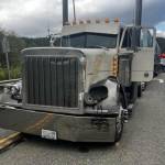 Photo courtesy Chris Turner, Clallam County Fire District 3/ A semi-truck driver is uninjured after an SUV allegedly failed to yield while turning west onto U.S. Highway 101 from 7 Cedars Casino on Oct. 4. The SUVs passenger was flown to Harborview Medical Center, and the driver was taken to Olympic Medical Center in Port Angeles and later arrested under suspicion of driving under the influence, reports Washington State Patrol.