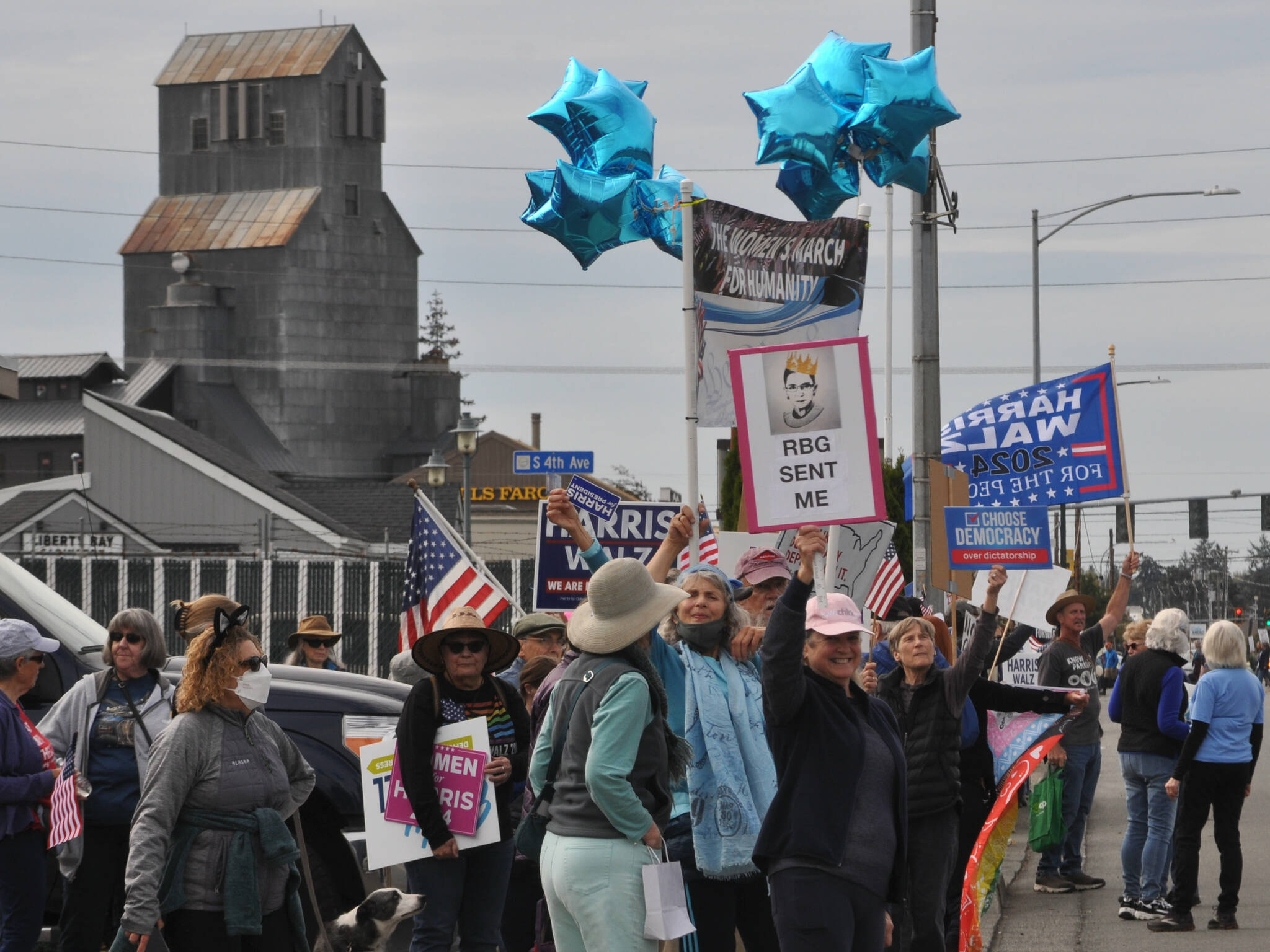 Sequim Gazette photos by Matthew Nash
Walkers during the Womens March for Humanity continue down the south side of Washington Street after walking from Sequim Avenue to Fifth Avenue holding various campaign and political signs.