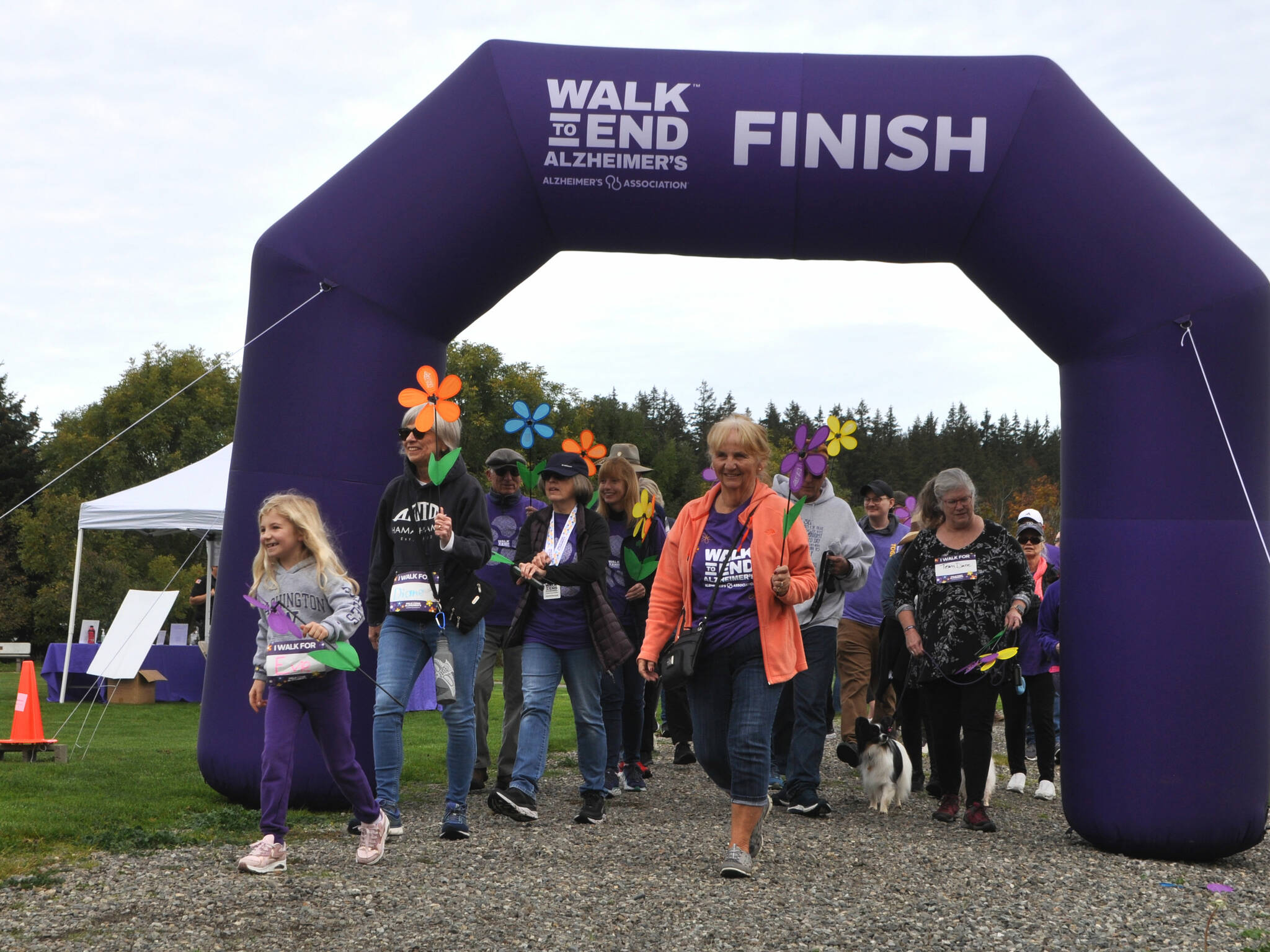Sequim Gazette photos by Matthew Nash
Walkers begin the Walk to End Alzheimers event in Carrie Blake Community Park on Oct. 5. Organizers estimate they raised about $35,000 so far for research and support services for Alzheimers disease. Donations can still be made at act.alz.org/nop.
