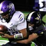 Photo by Elisha Meyer/Kitsap News Group Sequims Liam Wiker is tackled by North Kitsaps Townsyn Walsh in the first half of the Wolves 30-7 Olympic League loss in Poulsbo on Oct. 10.