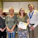 Photo courtesy of Olympic Medical Center 
Kris Spear, an Olympic Medical Center certified nursing assistant (second from left), receives an Olympic Medical Center BEE Award (Being Excellent Every Day) award. Pictured, from left, are BEE award chair Emily Fry, Spear, medical/surgical/pediatrics director Denise Harman and OMC CEO Darryl Wolfe.