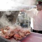 Photo by Keith Thorpe/Olympic Peninsula News Group Mario Casarez of U.S. Food pours out a batch of freshly-boiled crabs in preparation for todays opening day (Friday, Oct. 11) of the Dungeness Crab Festival. The three-day festival celebrates a wide variety of seafood available for purchase, as well as music, merchandise vendors and other activities centered around the Red Lion Hotel parking lot and other nearby venues.