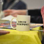 Sequim Gazette photo by Matthew Nash/ Marylaura Ramponi sat with her late husband Louies personalized Sequim Masonic Lodge mug at an Oct. 17 coffee meeting where she presented Sequim School District $500,000 for a new vocational building. Marylaura said the day was extra special because it was Louies 89th birthday.