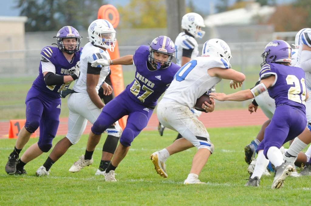 Sequim Gazette photo by Matthew Nash/ Sequims Josiah Tuller-Chavez makes a tackle against an Olympic player on Oct. 19.