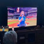 Sequim Gazette file photo by Matthew Nash/ About 30 people gathered inside the Sequim Boys & Girls Club to watch Pearle Peterson sing during the World Series last October. She returns to sing the national anthem on Oct. 26 prior to the game between the New York Yankees and Los Angeles Dodgers.