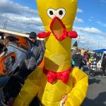 Sequim Gazette photo by Matthew Nash/ Eleven-year-old Eli Himmelberger visits the Olympic Peninsula Rat Racers Trunk-or-Treat on Oct. 26 at the Sequim Village Shopping Center dressed as a giant inflatable chicken.