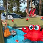 Giovanni Cerutti greets trick-or-treaters from his boat float during the Sequim Prairie Granges Fall Festival and Trunk-or-Treat on Oct. 26.
