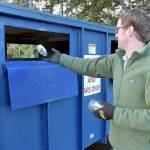 Photo by Keith Thorpe/Olympic Peninsula News Group
Beeler Van Orman of Port Angeles tosses a glass bottle into a recycling bin on Thursday at the Regional Transfer Station in Port Angeles.