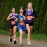 Sequim Gazette photo by Michael Dashiell / Sequim's Manuela Valle Jover, left, and Bridget "Birdie" Pyeatt, right, race at the Olympic League Cross Country Championships on Oct. 24.