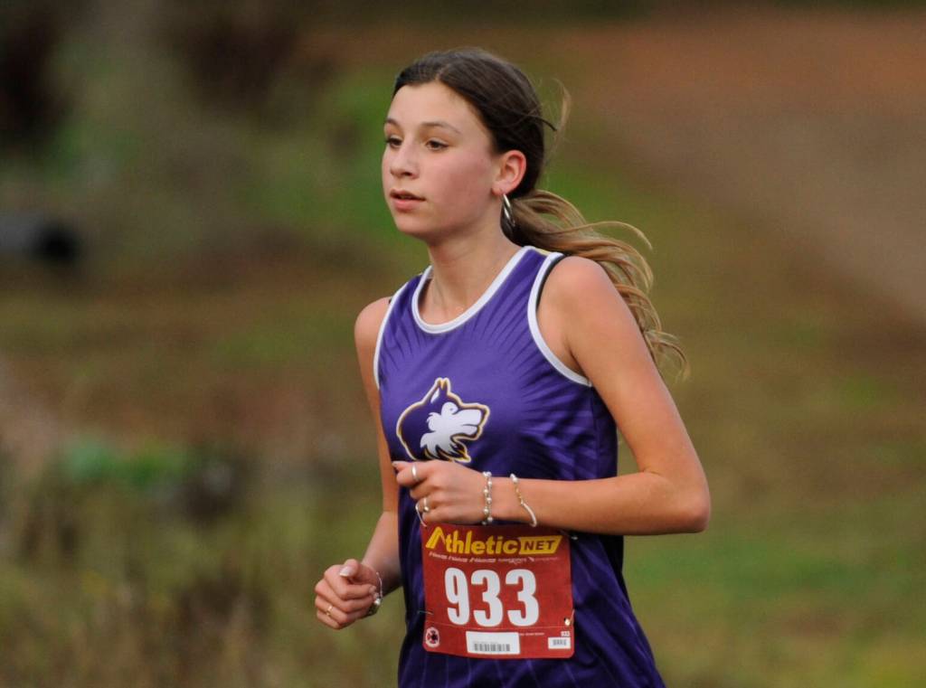Sequim Gazette photo by Michael Dashiell / Sequim freshman Marea Denton races to a 15th place finish at the Olympic League finals last week, helping SHS take third place.