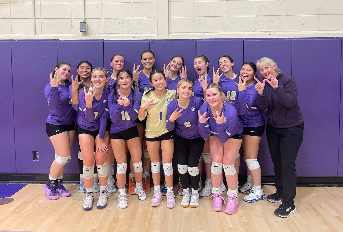 Photo courtesy of Sequim High volleyball
Sequim High Schools varsity volleyball squad celebrates a big win over rival North Kitsap in Poulsbo on Oct. 24.