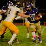 Sequim running back Liam Wiker, right, looks to get past Bainbridges Adrian Ayling in the second quarter of an Oct. 25 Olympic League game.