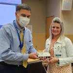 Photo courtesy of Olympic Medical Center / Nikki Brown,
Olympic Medical Physicians call center supervisor, receives an Olympic Medical Center Leadership Award from OMC CEO Darryl Wolfe.