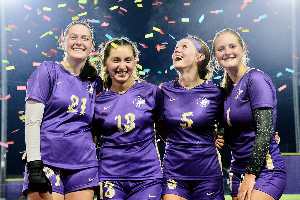 Photo by Daniel James / Sequim High girls soccers four seniors celebrate a big win over Bremerton (13-1) on Oct. 29. Pictured, from left, are Amara Gonzalez, Kalli Grove, Ivy Barrett and Libby Turella.