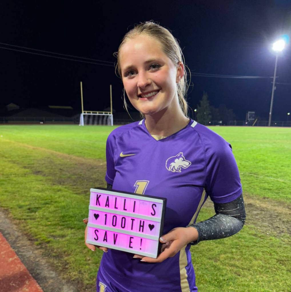 Photo by Kirsten Grove / Sequim goalkeeper Kalli Grove celebrates her 100th save of the season following a 13-1 Sequim win over Bremerton on Oct. 29.