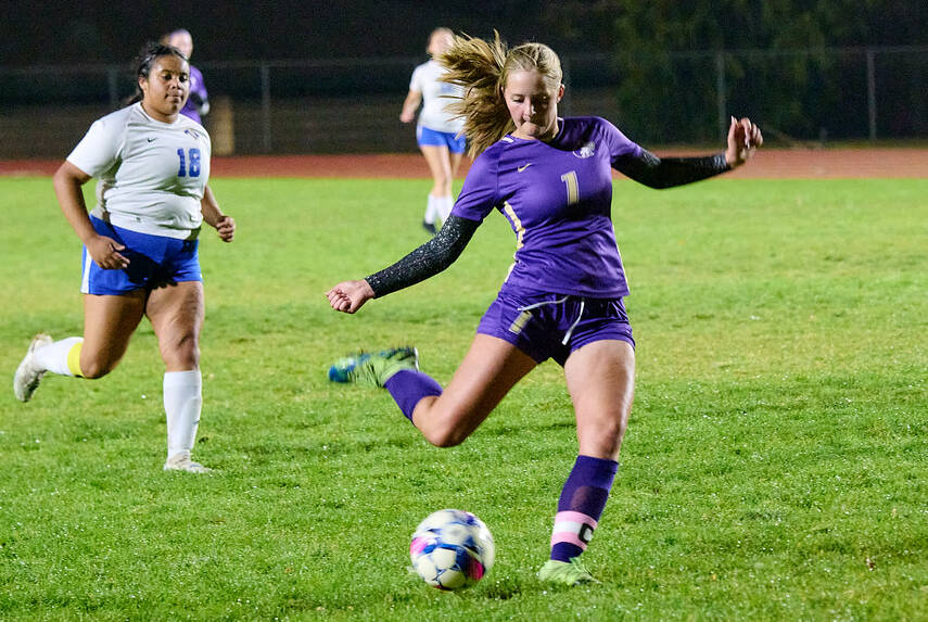 Photo by Daniel James / Sequims Kalli Groves takes a break from her goalkeeping duties to put a shot on goal in the Wolves 13-1 home win over Bremerton on Oct. 29.