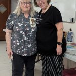 Photo by Christine Brehan / At left, Olympic Peninsula Doll Club co-founder Sandy Brehan shares a moment with current club president (and her daughter), Christine Brehan.