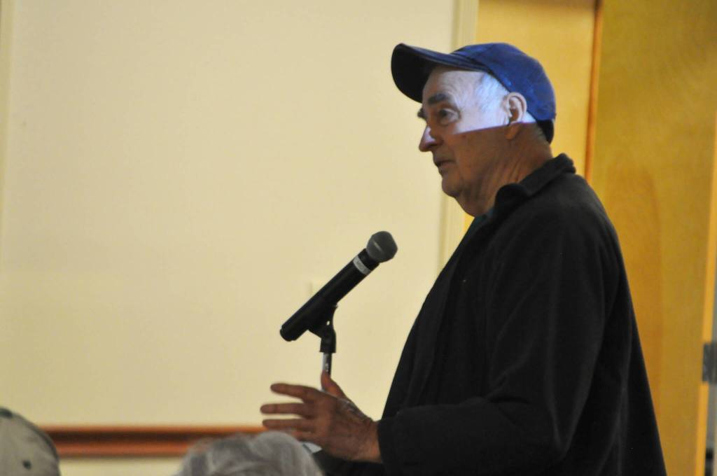 Sequim Gazette photo by Matthew Nash/ Russell Renk asks Clallam County officials about public access to the Dungeness Off-Channel Reservoir on Oct. 22. Staff said there are no final plans to fence the property and it will remain open to the public.