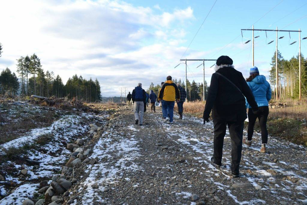 Sequim Gazette file photo by Matthew Nash/ Residents and stakeholders visit the site of the proposed Dungeness Off-Channel Reservoir in 2017. The property recently sold from the Department of Natural Resources to Clallam County to host the reservoir and park.