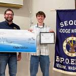 Photo courtesy by Sequim Elks Lodge / Sequim High sophomore Mason 
Rapelje accepts his Sequim Elks Lodge Student of the Month honor from Sequim Elks Exalted Ruler Klayton Waldron.
