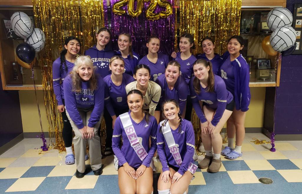 Photo courtesy of Sequim High volleyball / Sequim High's volleyball squad celebrates a big in won Senior Night (Oct. 29), a straight-set win over Bremerton.