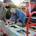 Sequim Gazette file photo by Matthew Nash
Andra Smith, executive director of the Sequim Food Bank, left, and volunteer Isabelle Dunlop prep some donations from River Run Farm in October 2021.