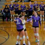 Sequim teammates congratulate libero Tiffany Lam after a spectacular effort led to a point in the Wolves Olympic League title game against Bainbridge on Nov. 2.
