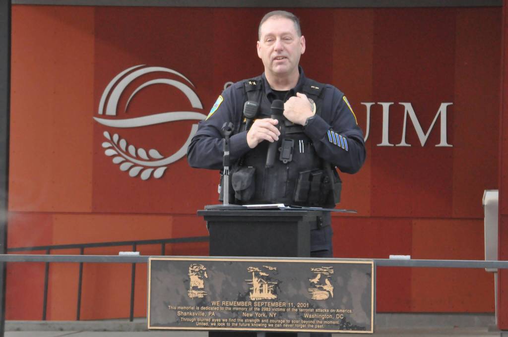 At a ceremony honoring veterans, Deputy Police Chief John Southard recognizes 11 City of Sequim staffers that served in the military. He is one of seven servicemen on the police force.
