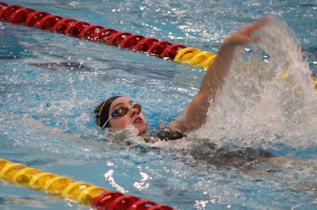 Photo courtesy Eric Ellefson/ Sequims Ava Shinkle swims the backstroke during the West Central III 1A/2A district meet, where she qualified for state in multiple events. She went on to win seventh in the 200 IM last weekend.