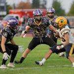 Sequim Gazette file photo by Michael Dashiell
Sequims Zeke Schmadeke, pictured readying to tackle a Forks runner earlier this season in Sequim, made the all-Olympic League first team as a defensive back.