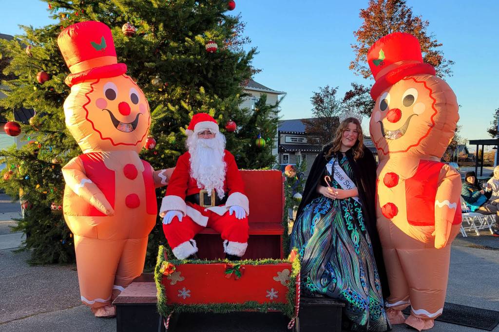 Photo courtesy of Sequim-Dungeness Valley Chamber of Commerce/ Santa and Sequim Irrigation Royalty Skylar Kryzworz ready to greet visitors at Hometown Holidays in 2023. Santa and the royalty return Nov. 30 to Centennial Place.