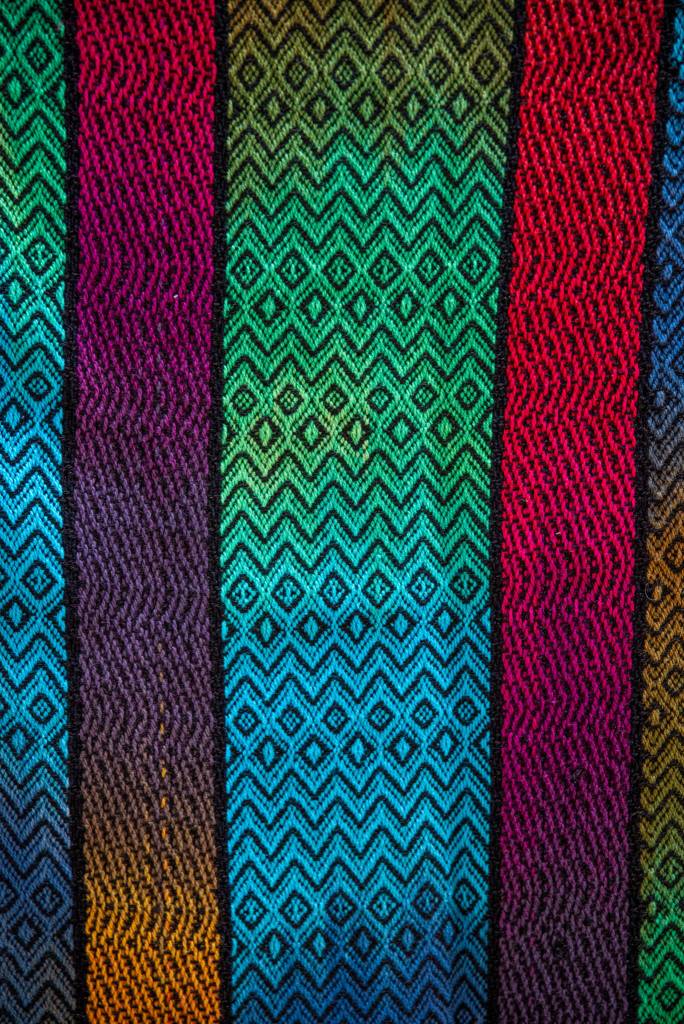 Sequim Gazette photo by Emily Matthiessen/ This is an example of the work of master weaver Lynn Baritelle, who also dyes and spins fiber to produce thread for her weavings. The luminous color, soft texture and intricacy of pattern can only be hinted at in a photograph.