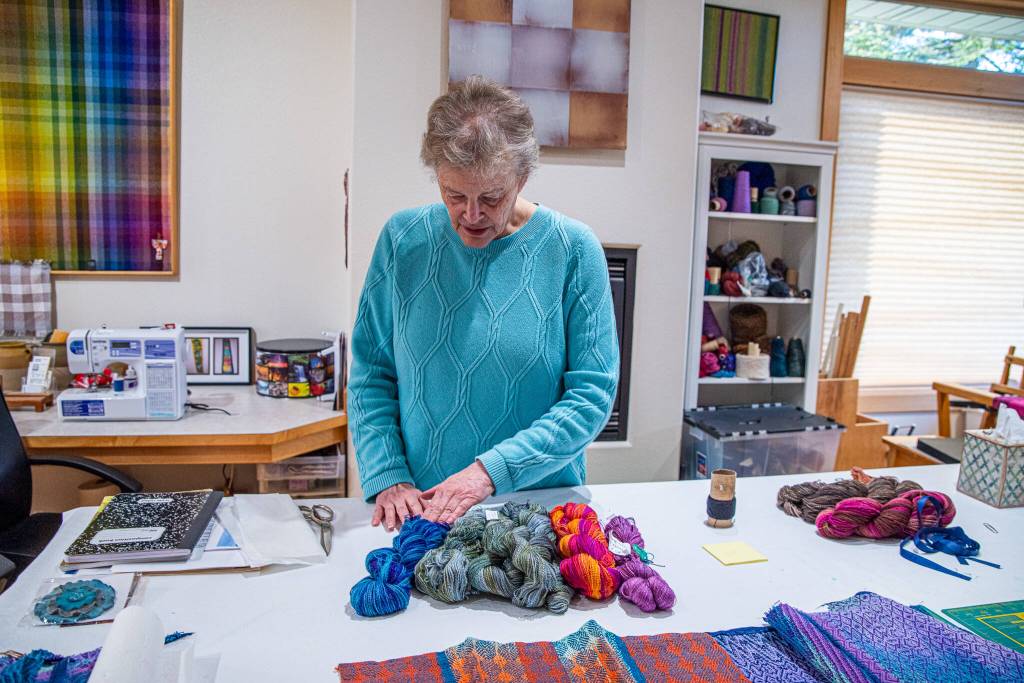 Sequim Gazette photo by Emily Matthiessen/ Lynn Baritelle, pictured in her studio, is a weaver and fiber artist with more than 5 decades of experience. Her guild, the North Olympic Shuttle and Spindle Guild, will hold their textile sale, Celebrating Color, at Megan Cyphers Locally Known Cowork, 112 W. Washington Street in Sequim on Dec. 6 and 7.