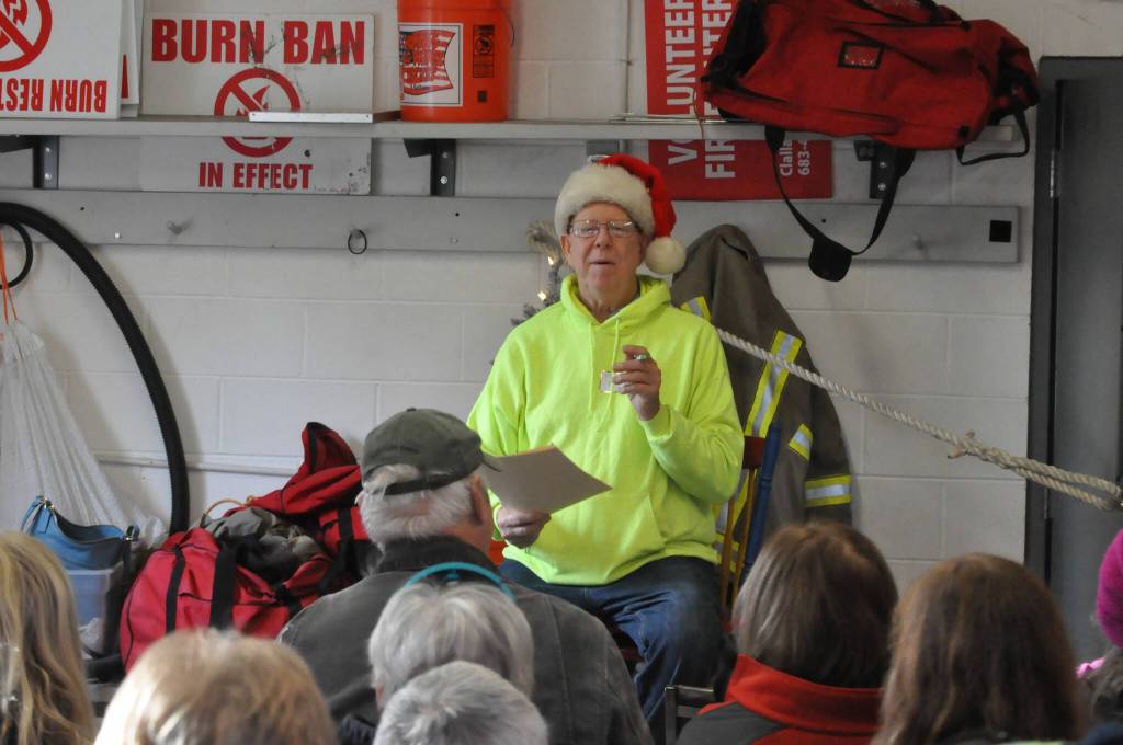 Marty Tall Elf Hoffman talks to a full house of volunteers inside Diamond Point Fire Station on Nov. 23. About 40 neighbors worked together to decorate the approximate four miles of Diamond Point Road for the holidays with ornaments, nutcrackers and more.