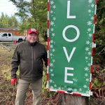 Sequim Gazette photo by Matthew Nash/ Tony Gilman stands by one of the 15 signs he made with George Ehrlich. The signs can be seen along Diamond Point Road and feature lights and reflective tape so they can be seen at night.