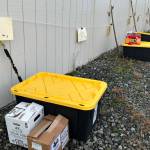 Sequim Gazette photo by Matthew Nash/ Totes and boxes of decorations await volunteers to pick up and disperse along Diamond Point Road for the areas Holiday Lane.