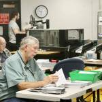Photo by Dave Logan for Olympic Peninsula News Group/ Ray Farrell, left, and Daniel Cain, center, prepare mail-in ballots for counting on Nov. 5 at the Clallam County courthouse in Port Angeles. The Clallam County General Election was certified on Nov. 26 and Washingtons election certified on Dec. 5.