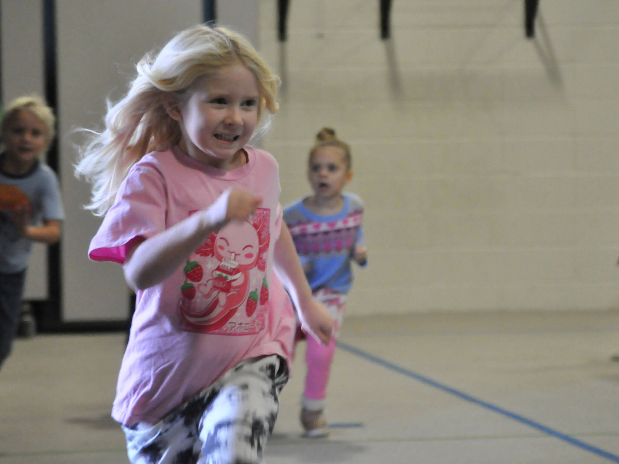 Sequim Gazette photos by Matthew Nash
Kindergartener Mary Wakefield runs a lap during Sequim Elementary PTAs Turkey Trot in Greywolf Elementary Schools gym.