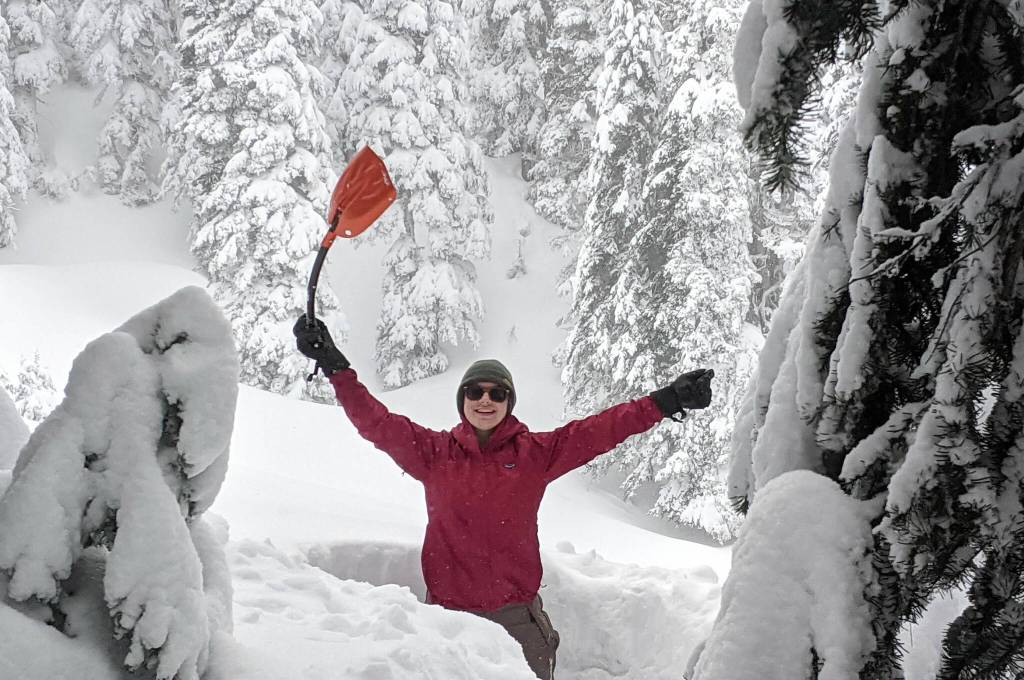 Photo courtesy Grace Kathol/ Grace Kathol with Troop 7498 makes a snow cave during an adventure.