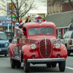 Sequim Gazette photo by Emily Matthiessen/ Santa's firetruck moves along with traffic.