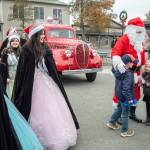Sequim Gazette photo by Emily Matthiessen/ Sequim Irrigation Royalty and Santa Claus greet young fans at Hometown Holidays on Saturday.