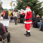 Sequim Gazette photos by Emily Matthiessen
Santa Claus treats townspeople to a display of his conducting skills while the Sequim City Band plays on at Hometown Holidays on Nov. 30.
