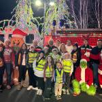 Sequim Gazette photo by Matthew Nash/ Santas Toy and Food Brigade takes a group photo on Dec. 5 at the Cedars at Dungeness. They went through the Sequim area Dec. 2-6 seeking food, toy and monetary donations for Toys for Sequim Kids and the Sequim Food Bank.