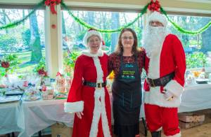 Sequim Gazette photo by Emily Matthiessen
Santa and Mrs. Claus (played by Ellen and John Castleman) stand with Della LaCour, who originated the idea to bring back the Sequim Prairie Garden Clubs tea event on Dec. 7. She said that when members of the club were going through old scrapbooks upon their 75th anniversary last year, we came across pictures of the tea, and they would like to make it a tradition going forward.